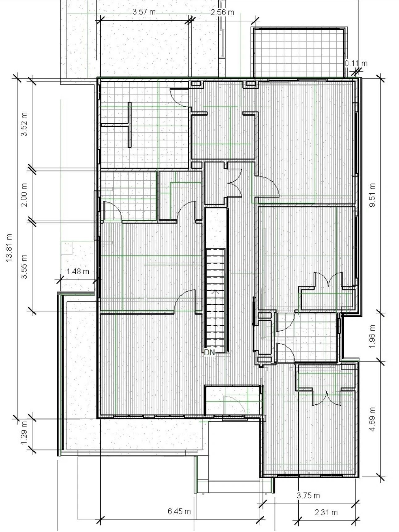 A dimensioned architectural floor plan: rooms, wall types, door swings, a stair marked DN, and overall dimensions running down both edges.